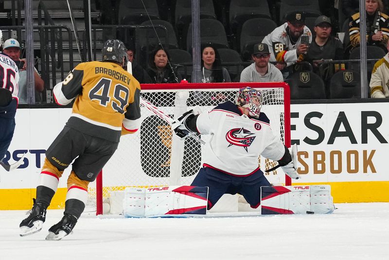 Jan 30, 2025; Las Vegas, Nevada, USA; Columbus Blue Jackets goaltender Elvis Merzlikins (90) makes a save against Vegas Golden Knights center Jack Eichel (9) during the first period at T-Mobile Arena. Mandatory Credit: Stephen R. Sylvanie-Imagn Images