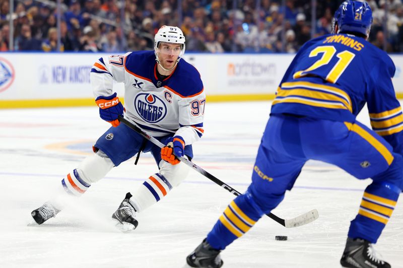 Nov 17, 2025; Buffalo, New York, USA;  Edmonton Oilers center Connor McDavid (97) looks to pass during the first period against the Buffalo Sabres at KeyBank Center. Mandatory Credit: Timothy T. Ludwig-Imagn Images