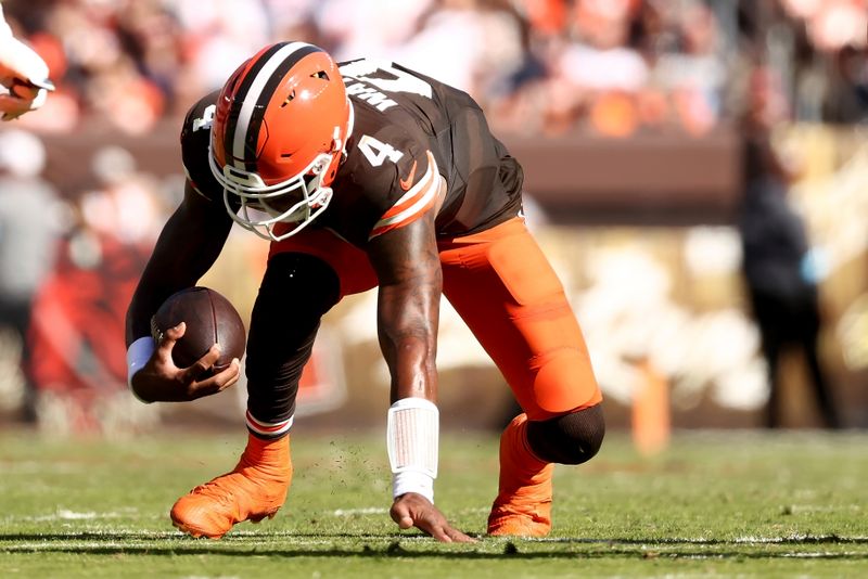 Cleveland Browns quarterback Deshaun Watson (4) injures his achilles tendon while running with the ball during an NFL football game against the Cincinnati Bengals, Sunday, Oct. 20, 2024, in Cleveland. (AP Photo/Kirk Irwin)