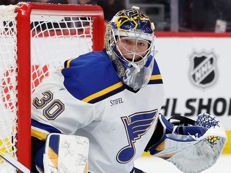 Feb 24, 2024; Detroit, Michigan, USA;  St. Louis Blues goaltender Joel Hofer (30) makes a save in the second period against the Detroit Red Wings at Little Caesars Arena. Mandatory Credit: Rick Osentoski-USA TODAY Sports