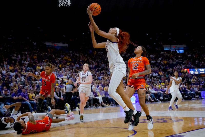 Feb 22, 2024; Baton Rouge, Louisiana, USA;  LSU Lady Tigers forward Angel Reese (10) shoots against Auburn Tigers guard Mar'shaun Bostic (12) but the basket was called off because LSU Lady Tigers guard Aneesah Morrow (24) ran into Auburn Tigers guard Sydney Shaw (5) during the first half at Pete Maravich Assembly Center. Mandatory Credit: Matthew Hinton-USA TODAY Sports