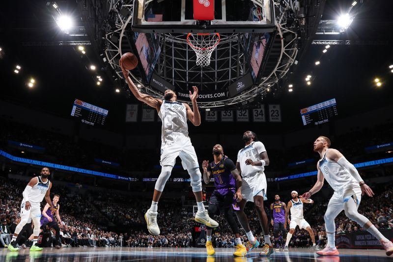 MINNEAPOLIS, MN - DECEMBER 2: Rudy Gobert #27 of the Minnesota Timberwolves rebounds the ball during the game against the Los Angeles Lakers on December 2, 2024 at Target Center in Minneapolis, Minnesota. NOTE TO USER: User expressly acknowledges and agrees that, by downloading and or using this Photograph, user is consenting to the terms and conditions of the Getty Images License Agreement. Mandatory Copyright Notice: Copyright 2024 NBAE (Photo by Jordan Johnson/NBAE via Getty Images)