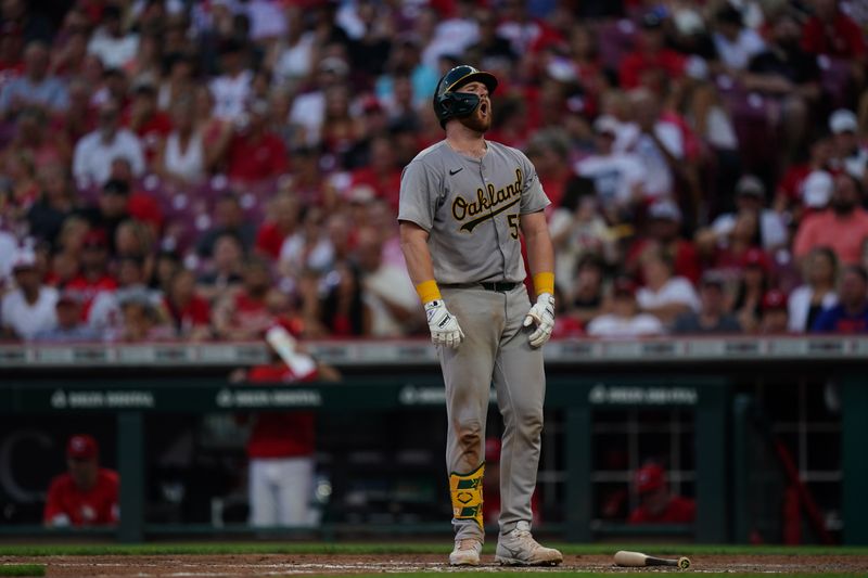 Aug 29, 2024; Cincinnati, Ohio, USA;  Oakland Athletics catcher Kyle McCann (52) reacts to a strikeout during the eighth inning of the MLB game between the Cincinnati Reds and Oakland Athletics, Thursday, Aug. 29, 2024, at Cintas Center in Cincinnati. The Reds won 10-9. Mandatory Credit: Frank Bowen IV/The Cincinnati Enquirer-USA TODAY Sports