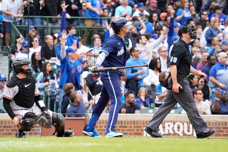 Jun 16, 2023; Chicago, Illinois, USA; Chicago Cubs center fielder Christopher Morel (5) hits a home run against the Baltimore Orioles during the third inning at Wrigley Field. Mandatory Credit: David Banks-USA TODAY Sports