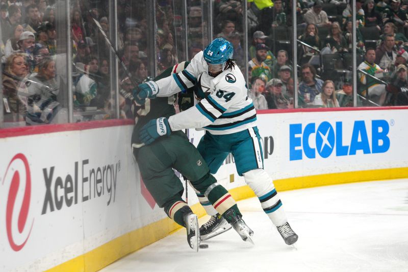 Mar 3, 2024; Saint Paul, Minnesota, USA; San Jose Sharks right wing Givani Smith (54) pushes Minnesota Wild defenseman Jonas Brodin (25) into the boards in the first period at Xcel Energy Center. Mandatory Credit: Matt Blewett-USA TODAY Sports