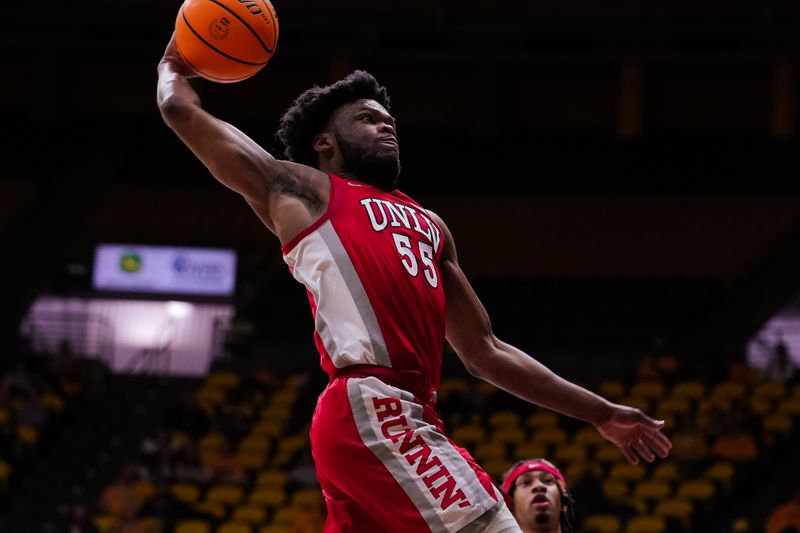 Feb 8, 2023; Laramie, Wyoming, USA; UNLV Runnin' Rebels guard EJ Harkless (55) drives to the basket against the Wyoming Cowboys during the first half at Arena-Auditorium. Mandatory Credit: Troy Babbitt-USA TODAY Sports