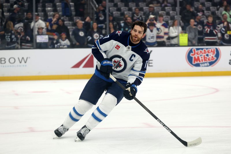 Apr 1, 2025; Los Angeles, California, USA;  Winnipeg Jets center Adam Lowry (17) warms up before the game against the Los Angeles Kings at Crypto.com Arena. Mandatory Credit: Kiyoshi Mio-Imagn Images