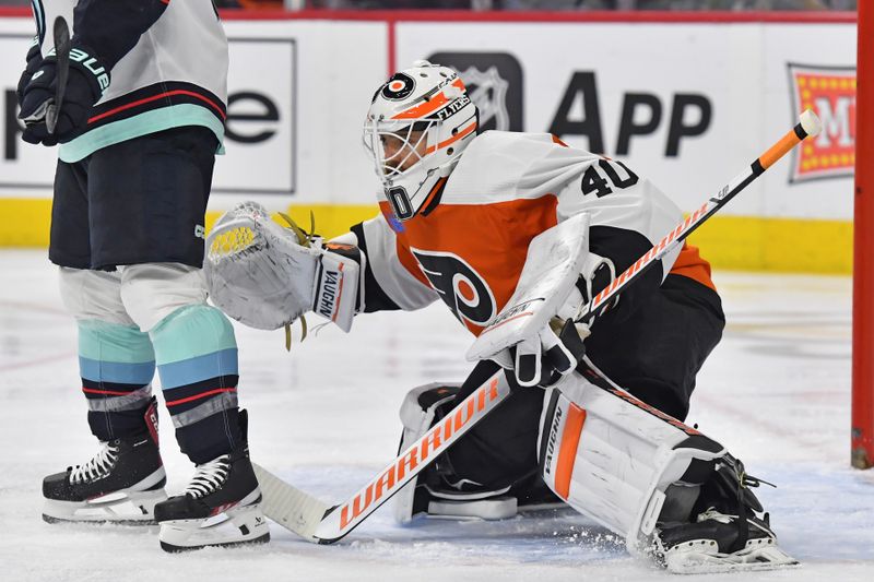 Feb 10, 2024; Philadelphia, Pennsylvania, USA; Philadelphia Flyers goaltender Cal Petersen (40) tries to look around screen by Seattle Kraken center Jaden Schwartz (17) during the second period at Wells Fargo Center. Mandatory Credit: Eric Hartline-USA TODAY Sports