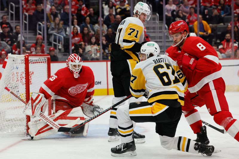 Oct 18, 2023; Detroit, Michigan, USA; Pittsburgh Penguins right wing Rickard Rakell (67) and Detroit Red Wings defenseman Ben Chiarot (8) fight for position in front of Detroit Red Wings goaltender Ville Husso (35) in the third period at Little Caesars Arena. Mandatory Credit: Rick Osentoski-USA TODAY Sports