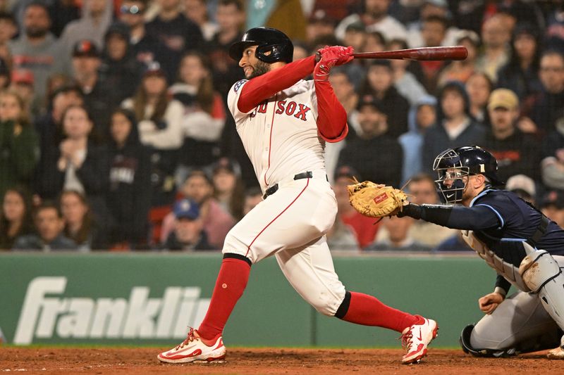 Jun 9, 2025; Boston, Massachusetts, USA; Boston Red Sox first baseman Abraham Toro (29) hits a RBI against the Tampa Bay Rays during the tenth inning at Fenway Park. Mandatory Credit: Brian Fluharty-Imagn Images