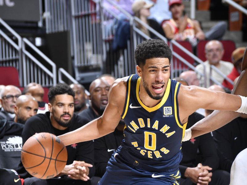 HOUSTON, TX - NOVEMBER 20:  Tyrese Haliburton #0 of the Indiana Pacers drives to the basket during the game against the Houston Rockets on November 20, 2024 at the Toyota Center in Houston, Texas. NOTE TO USER: User expressly acknowledges and agrees that, by downloading and or using this photograph, User is consenting to the terms and conditions of the Getty Images License Agreement. Mandatory Copyright Notice: Copyright 2024 NBAE (Photo by Logan Riely/NBAE via Getty Images)