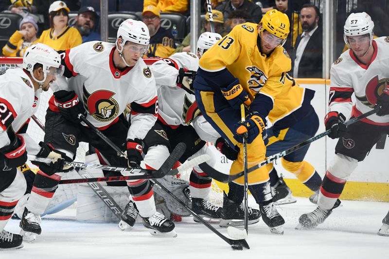 Feb 27, 2024; Nashville, Tennessee, USA; Nashville Predators center Yakov Trenin (13) battles for a loose puck against Ottawa Senators defenseman Jakob Chychrun (6) in front of the net during the first period at Bridgestone Arena. Mandatory Credit: Christopher Hanewinckel-USA TODAY Sports