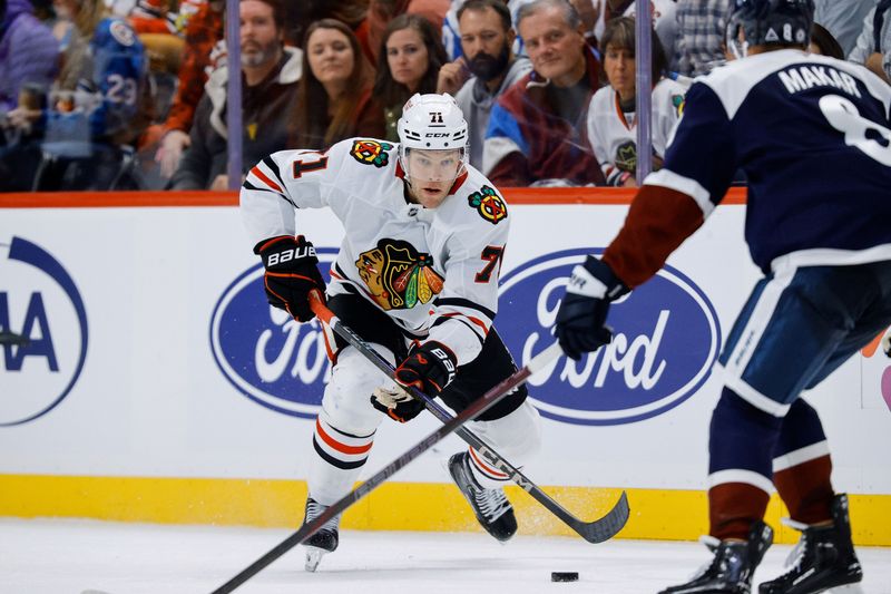 Oct 28, 2024; Denver, Colorado, USA; Chicago Blackhawks left wing Taylor Hall (71) controls the puck as Colorado Avalanche defenseman Cale Makar (8) defends in the third period at Ball Arena. Mandatory Credit: Isaiah J. Downing-Imagn Images