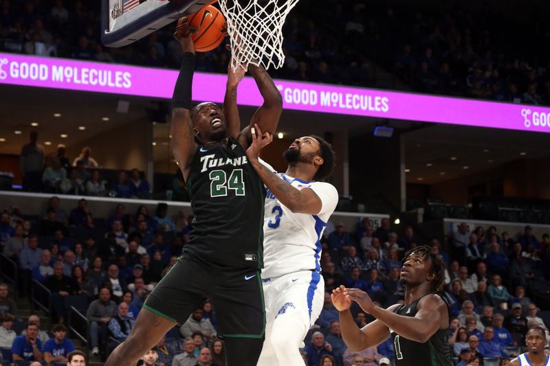 Feb 11, 2024; Memphis, Tennessee, USA; Tulane Green Wave forward Kevin Cross (24) collects a rebound over Memphis Tigers center Jordan Brown (3) during the first half at FedExForum. Mandatory Credit: Petre Thomas-USA TODAY Sports