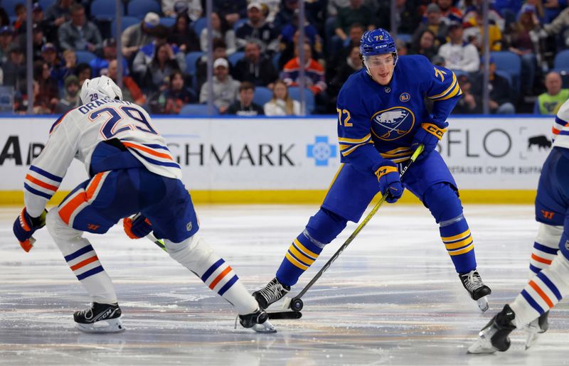 Mar 9, 2024; Buffalo, New York, USA;  Edmonton Oilers center Leon Draisaitl (29) tries to knock the puck off the stick of Buffalo Sabres right wing Tage Thompson (72) during the second period at KeyBank Center. Mandatory Credit: Timothy T. Ludwig-USA TODAY Sports