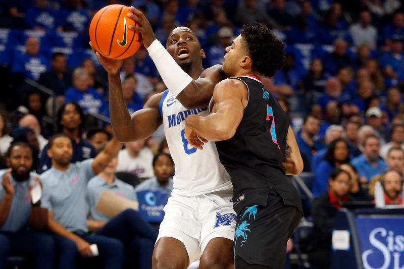 Feb 25, 2024; Memphis, Tennessee, USA; Memphis Tigers forward David Jones (8) drives to the basket as Florida Atlantic Owls guard Nick Boyd (2) defends during the first half at FedExForum. Mandatory Credit: Petre Thomas-USA TODAY Sports