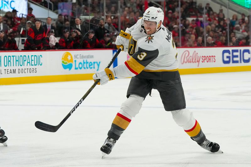 Mar 11, 2023; Raleigh, North Carolina, USA;  Vegas Golden Knights defenseman Brayden McNabb (3) takes a shot against the Carolina Hurricanes during the second period at PNC Arena. Mandatory Credit: James Guillory-USA TODAY Sports