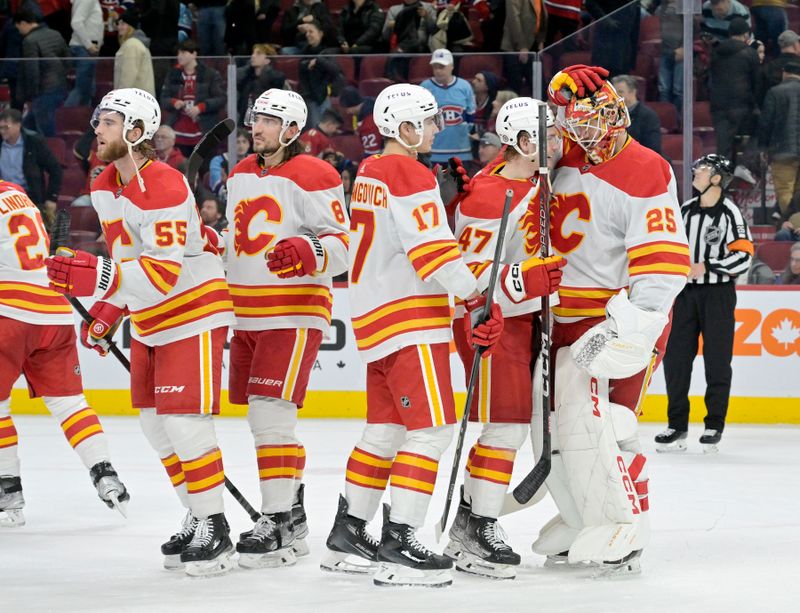 sNov 14, 2023; Montreal, Quebec, CAN; Calgary Flames goalie Jacob Markstrom (25) celebrates with teammates the victory against the Montreal Canadiens at the Bell Centre. Mandatory Credit: Eric Bolte-USA TODAY Sports