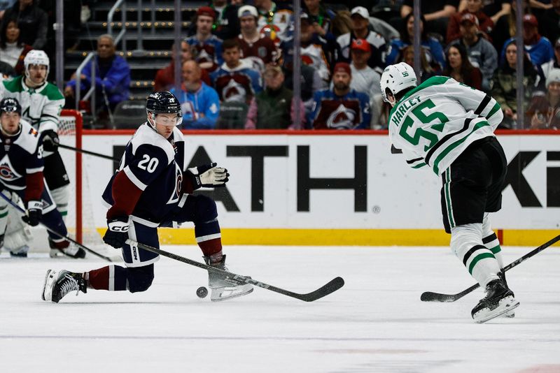 Mar 16, 2025; Denver, Colorado, USA; Colorado Avalanche center Ross Colton (20) blocks a shot from Dallas Stars defenseman Thomas Harley (55) in the second period at Ball Arena. Mandatory Credit: Isaiah J. Downing-Imagn Images