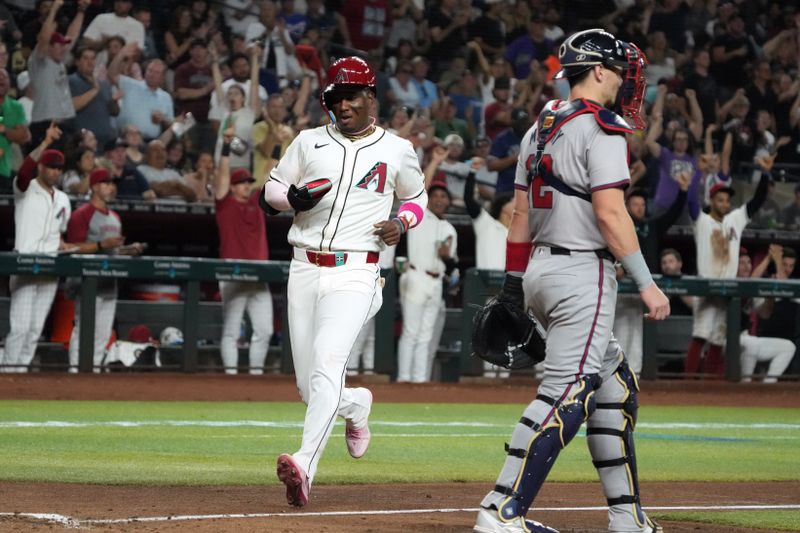 Jul 8, 2024; Phoenix, Arizona, USA; Arizona Diamondbacks shortstop Geraldo Perdomo (2) scores a run against the Atlanta Braves in the sixth inning at Chase Field. Mandatory Credit: Rick Scuteri-USA TODAY Sports