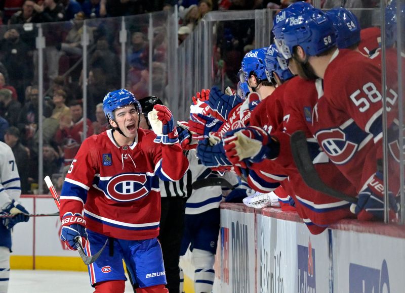 Mar 9, 2024; Montreal, Quebec, CAN; Montreal Canadiens forward Alex Newhook (15) celebrates with teammates after scoring a goal against the Toronto Maple Leafs during the third period at the Bell Centre. Mandatory Credit: Eric Bolte-USA TODAY Sports