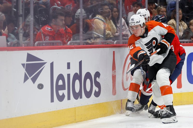 Sep 22, 2024; Washington, District of Columbia, USA; Philadelphia Flyers defenseman Spencer Gill (42) clears the puck from Washington Capitals forward Jakub Vrana (13) in the third period at Capital One Arena. Mandatory Credit: Geoff Burke-Imagn Images