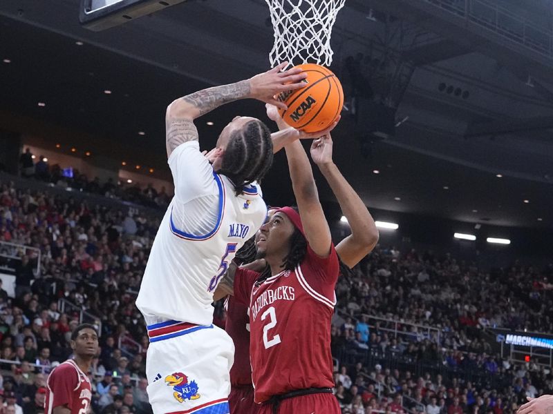 Can the Razorbacks' Tenacity Overcome the Jayhawks in a High-Stakes Playoff Duel?