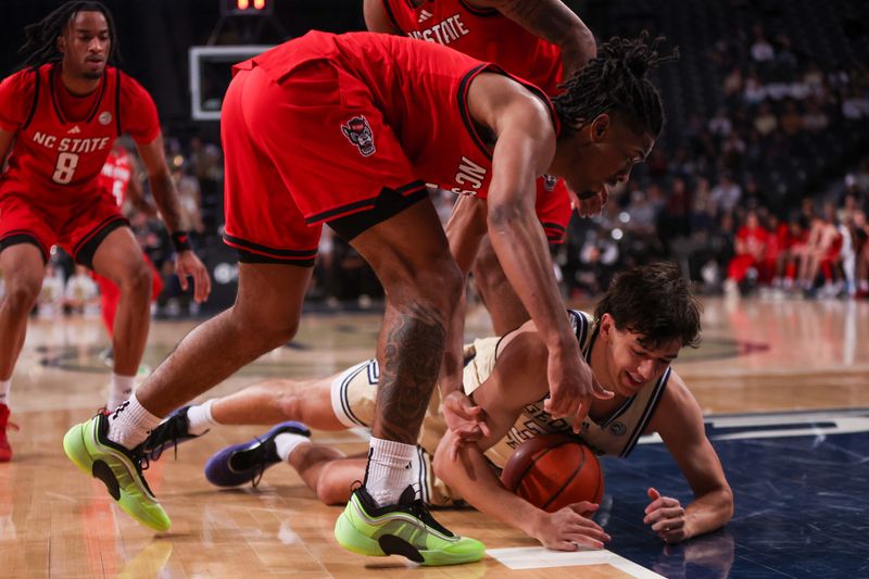 Mar 1, 2025; Atlanta, Georgia, USA; Georgia Tech Yellow Jackets guard Marcos San Miguel (33) dives for a loose ball against the North Carolina State Wolfpack in the second half at McCamish Pavilion. Mandatory Credit: Brett Davis-Imagn Images