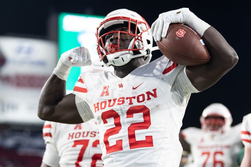 Nov 6, 2021; Tampa, Florida, USA; Houston Cougars running back Alton McCaskill (22) reacts after scoring a touchdown during the second half against the South Florida Bulls at Raymond James Stadium. Mandatory Credit: Matt Pendleton-USA TODAY Sports