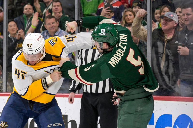 Jan 25, 2024; Saint Paul, Minnesota, USA; Nashville Predators forward Michael McCarron (47) and Minnesota Wild defenseman Jacob Middleton (5) fight during the second period at Xcel Energy Center. Mandatory Credit: Nick Wosika-USA TODAY Sports