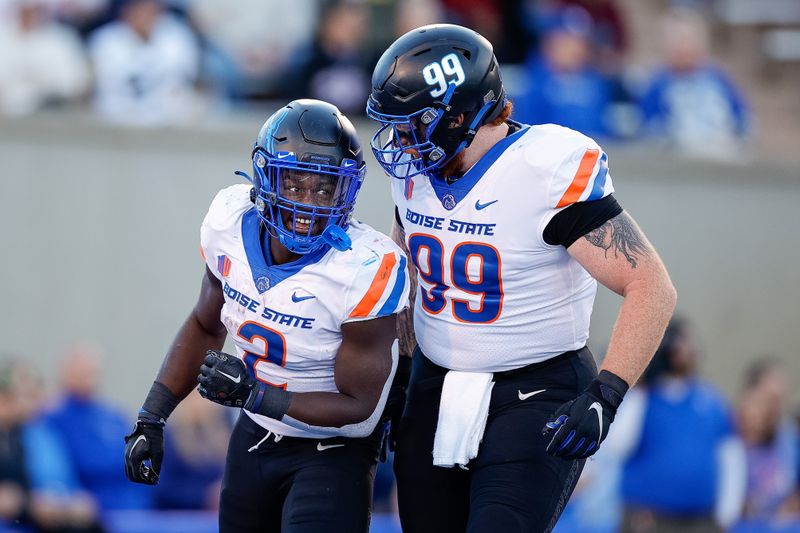 Oct 22, 2022; Colorado Springs, Colorado, USA; Boise State Broncos running back Ashton Jeanty (2) celebrates his touchdown with defensive tackle Scott Matlock (99) in the first quarter against the Air Force Falcons at Falcon Stadium. Mandatory Credit: Isaiah J. Downing-USA TODAY Sports