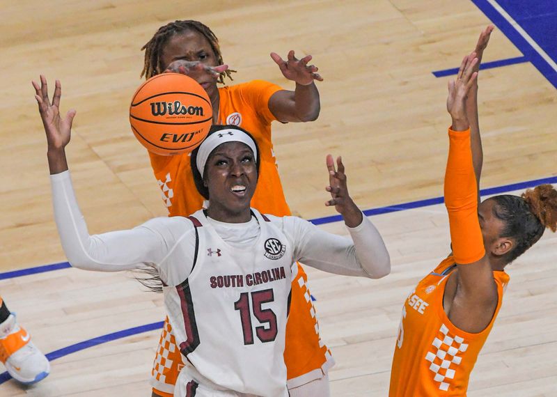 Mar 5, 2023; Greenville, SC, USA; Tennessee guard Jasmine Powell (15) strips the ball from South Carolina forward Laeticia Amihere (15) during the first quarter of the SEC Women's Basketball Tournament at Bon Secours Wellness Arena. Mandatory Credit: Ken Ruinard-USA TODAY Sports