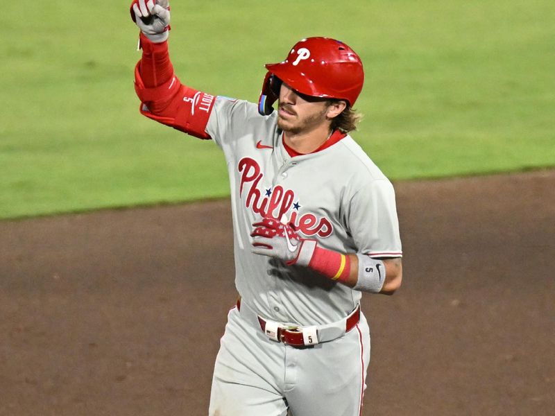 May 8, 2025; St. Petersburg, Florida, USA; Philadelphia Phillies second baseman Bryson Stott (5) reacts after hitting  a three run home run in the eighth inning against the Tampa Bay Rays at George M. Steinbrenner Field. Mandatory Credit: Jonathan Dyer-Imagn Images