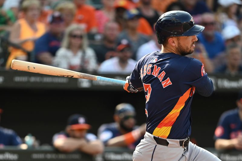 Aug 24, 2024; Baltimore, Maryland, USA;  Houston Astros third baseman Alex Bregman (2)  hits a third inning single against the Baltimore Orioles  at Oriole Park at Camden Yards. Mandatory Credit: Tommy Gilligan-USA TODAY Sports