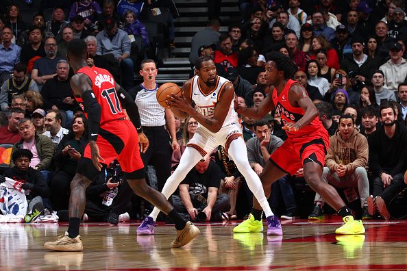 TORONTO, CANADA - NOVEMBER 29: Kevin Durant #35 of the Phoenix Suns handles the ball during the game against the Toronto Raptors on November 29, 2023 at the Scotiabank Arena in Toronto, Ontario, Canada.  NOTE TO USER: User expressly acknowledges and agrees that, by downloading and or using this Photograph, user is consenting to the terms and conditions of the Getty Images License Agreement.  Mandatory Copyright Notice: Copyright 2023 NBAE (Photo by Vaughn Ridley/NBAE via Getty Images)