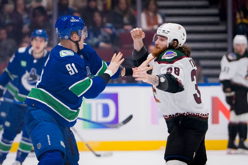 Jan 18, 2024; Vancouver, British Columbia, CAN; Vancouver Canucks defenseman Nikita Zadorov (91) fights with Arizona Coyotes forward Liam O'Brien (38) in the first period at Rogers Arena. Mandatory Credit: Bob Frid-USA TODAY Sports