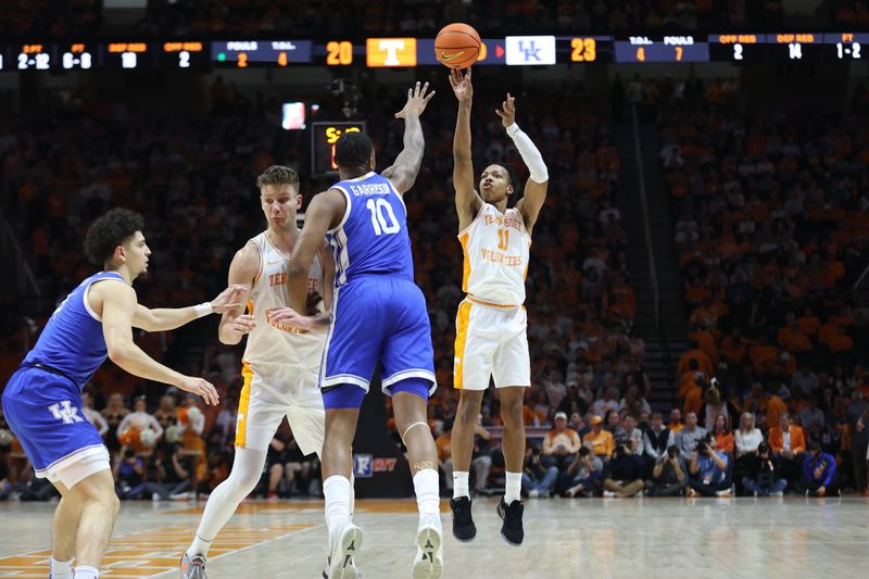 Jan 28, 2025; Knoxville, Tennessee, USA; Tennessee Volunteers guard Jordan Gainey (11) shoots the ball against Kentucky Wildcats forward Brandon Garrison (10) during the first half at Thompson-Boling Arena at Food City Center. Mandatory Credit: Randy Sartin-Imagn Images