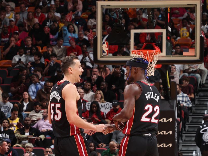 MIAMI, FL - DECEMBER 4: Duncan Robinson #55 high fives Jimmy Butler #22 of the Miami Heat during the game against the Los Angeles Lakers on December 4, 2024 at Kaseya Center in Miami, Florida. NOTE TO USER: User expressly acknowledges and agrees that, by downloading and or using this Photograph, user is consenting to the terms and conditions of the Getty Images License Agreement. Mandatory Copyright Notice: Copyright 2024 NBAE (Photo by Joe Murphy/NBAE via Getty Images)