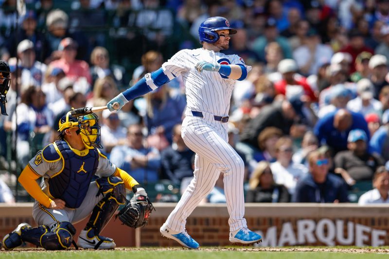 May 3, 2024; Chicago, Illinois, USA; Chicago Cubs outfielder Ian Happ (8) singles against the Milwaukee Brewers during the fourth inning at Wrigley Field. Mandatory Credit: Kamil Krzaczynski-USA TODAY Sports