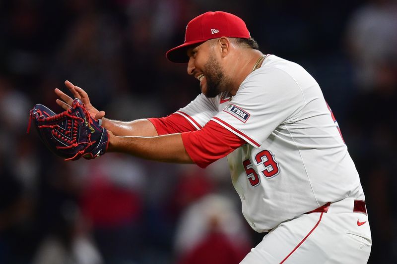 Jun 25, 2024; Anaheim, California, USA; Los Angeles Angels pitcher Carlos Estévez (53) celebrates the victory against the Oakland Athletics at Angel Stadium. Mandatory Credit: Gary A. Vasquez-USA TODAY Sports