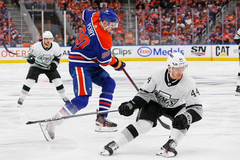 Apr 22, 2024; Edmonton, Alberta, CAN; Edmonton Oilers forward Corey Perry (90) jumps past Los Angeles Kings defensemen Mikey Anderson (44) during the third period in game one of the first round of the 2024 Stanley Cup Playoffs at Rogers Place. Mandatory Credit: Perry Nelson-USA TODAY Sports