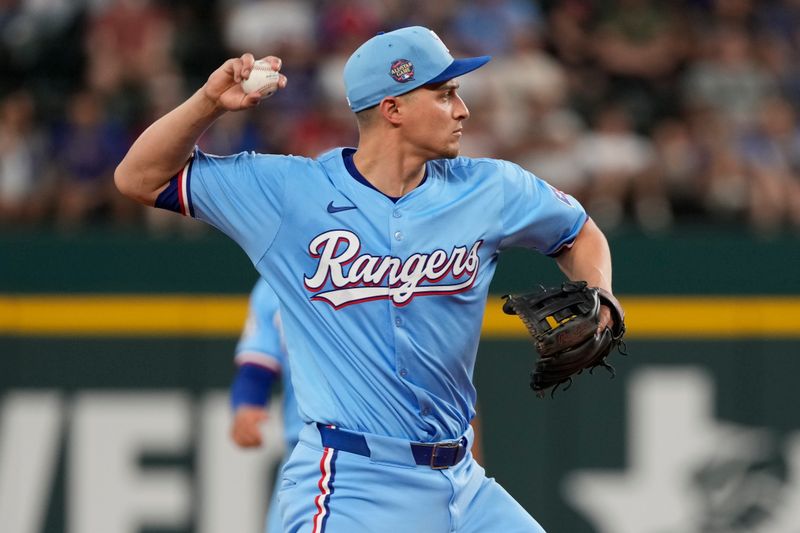 Jun 23, 2024; Arlington, Texas, USA; Texas Rangers shortstop Corey Seager (5) throws to first base on a ground out hit by Kansas City Royals center fielder Dairon Blanco (not shown) during the ninth inning at Globe Life Field. Mandatory Credit: Jim Cowsert-USA TODAY Sports