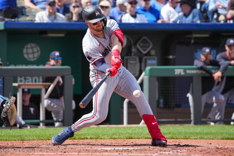 Apr 10, 2025; Kansas City, Missouri, USA; Minnesota Twins catcher Ryan Jeffers (27) hits a one run single against the Kansas City Royals in the sixth inning at Kauffman Stadium. Mandatory Credit: Denny Medley-Imagn Images