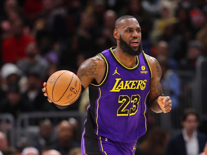 CHICAGO, ILLINOIS - DECEMBER 20: LeBron James #23 of the Los Angeles Lakers dribbles up the court against the Chicago Bulls during the first half at the United Center on December 20, 2023 in Chicago, Illinois. NOTE TO USER: User expressly acknowledges and agrees that, by downloading and or using this photograph, User is consenting to the terms and conditions of the Getty Images License Agreement.  (Photo by Michael Reaves/Getty Images)