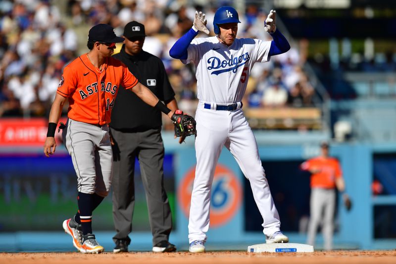 Jun 25, 2023; Los Angeles, California, USA; Los Angeles Dodgers first baseman Freddie Freeman (5) reaches second a double against the Houston Astros during the sixth inning at Dodger Stadium. Mandatory Credit: Gary A. Vasquez-USA TODAY Sports