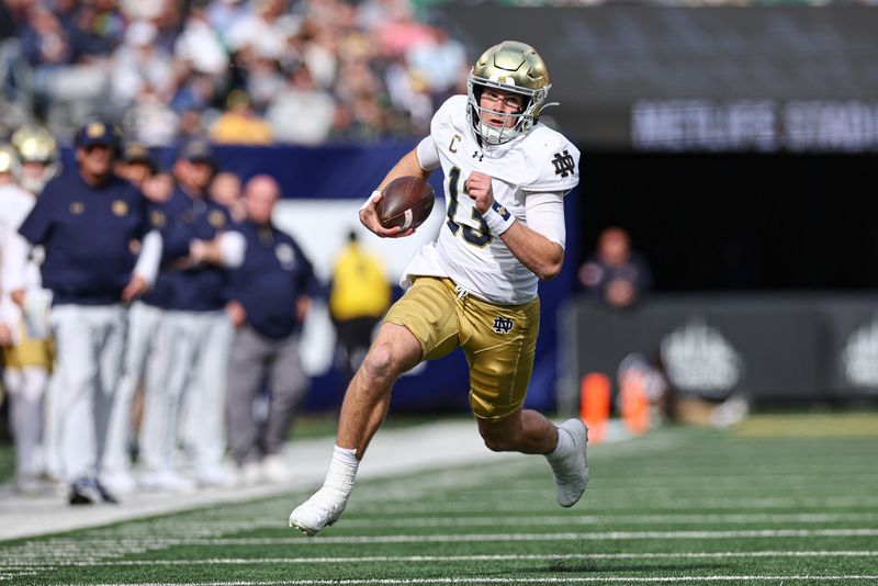 Oct 26, 2024; East Rutherford, New Jersey, USA;Notre Dame Fighting Irish quarterback Riley Leonard (13) carries the ball during the first half against the Navy Midshipmen at MetLife Stadium. Mandatory Credit: Vincent Carchietta-Imagn Images