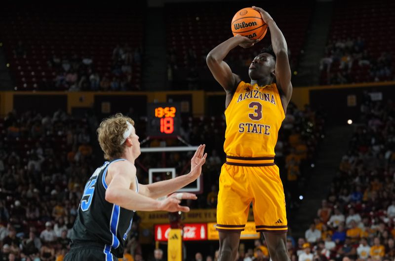 Feb 26, 2025; Tempe, Arizona, USA; Arizona State Sun Devils guard Joson Sanon (3) shoots over Brigham Young Cougars forward Richie Saunders (15) during the second half at Desert Financial Arena. Mandatory Credit: Joe Camporeale-Imagn Images