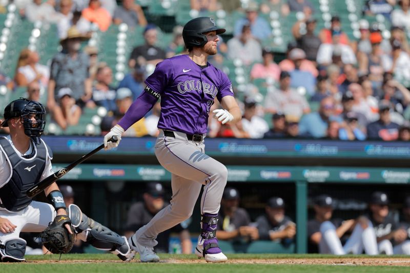 Sep 12, 2024; Detroit, Michigan, USA;  Colorado Rockies third base Ryan McMahon (24) hits a single in the fourth inning against the Detroit Tigers at Comerica Park. Mandatory Credit: Rick Osentoski-Imagn Images