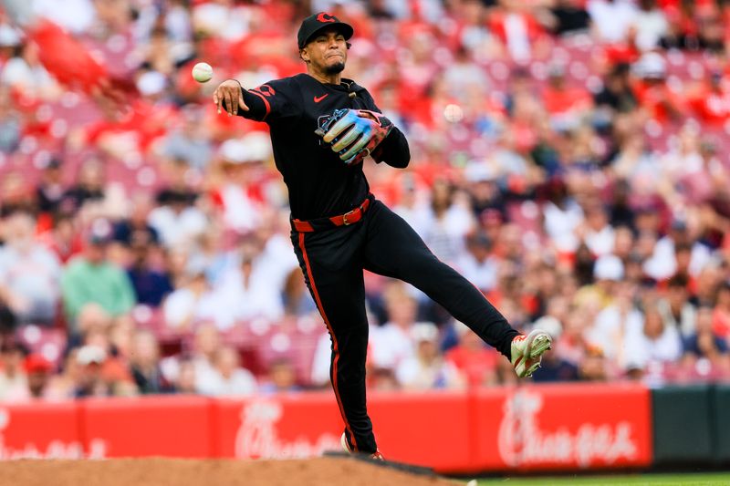 May 16, 2025; Cincinnati, Ohio, USA; Cincinnati Reds third baseman Santiago Espinal (4) throws to first to get Cleveland Guardians shortstop Gabriel Arias (not pictured) out in the seventh inning at Great American Ball Park. Mandatory Credit: Katie Stratman-Imagn Images