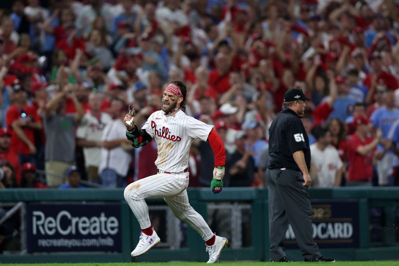 Oct 3, 2023; Philadelphia, Pennsylvania, USA; Philadelphia Phillies designated hitter Bryce Harper (3) runs toward home plate to score a run against the Miami Marlins in the eighth inning for game one of the Wildcard series for the 2023 MLB playoffs at Citizens Bank Park. Mandatory Credit: Bill Streicher-USA TODAY Sports